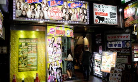 A young woman hovers in the doorway of one of Kabukicho’s information centres, which give recommendations for bars and sex shops. 