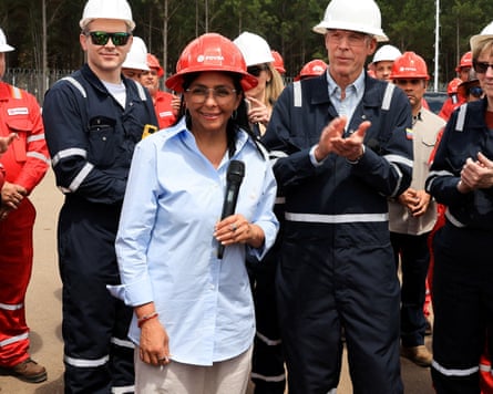 President Delcy Rodriguez and US Energy Secretary Chris Wright wearing orange hard hats