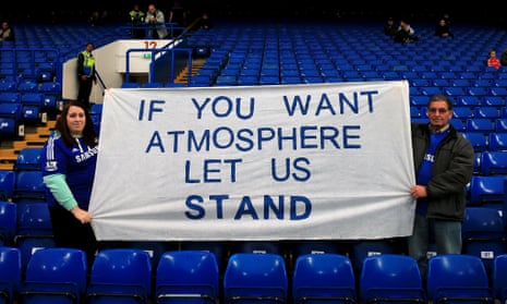 Chelsea fans hold up a banner in favour of standing at football matches