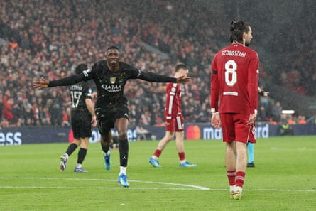Ousmane Dembélé celebrates scoring Paris Saint-Germain’s first goal at Liverpool in the second leg of their quarter-final