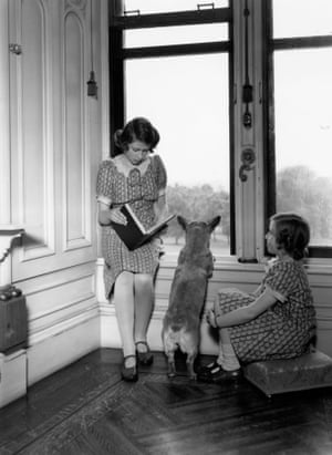 1940: Princess Elizabeth reads with her sister Princess Margaret
