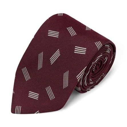 A burgundy tie with small white stripe details