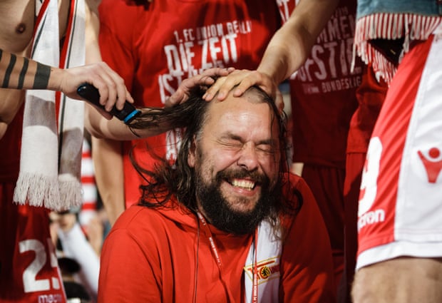Christian Arbeit, Union Berlin's stadium announcer and spokesman, has shaved his head in celebration of the promotion.