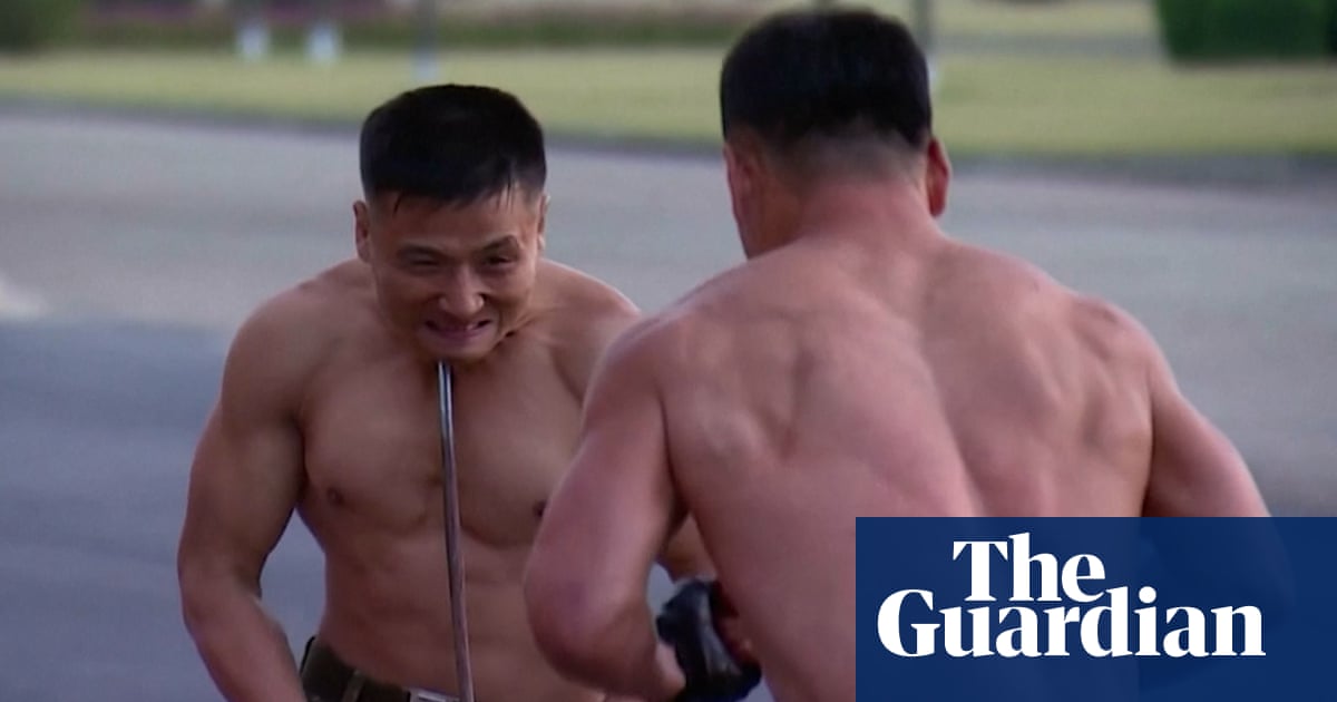 North Korean leader watches extreme martial arts performance – video