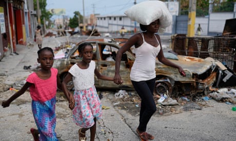 Residents flee as Haitian gangs launch new gun and arson attacks in capital
