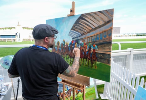An artist painting a scene ahead of the racing on day one of Royal Ascot.