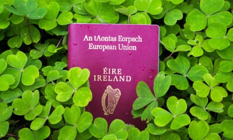 Irish passport in a bed of green clover.