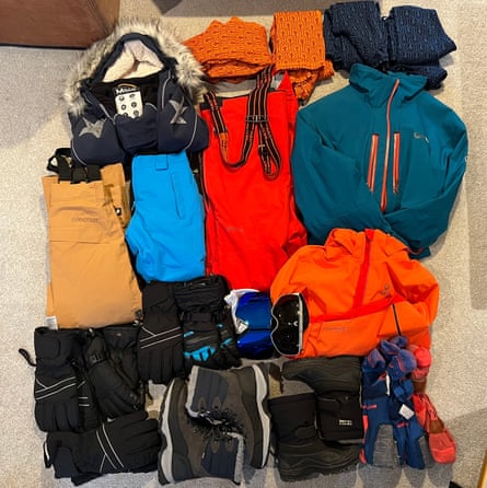 A colourful assortment of folded ski clothing and accessories