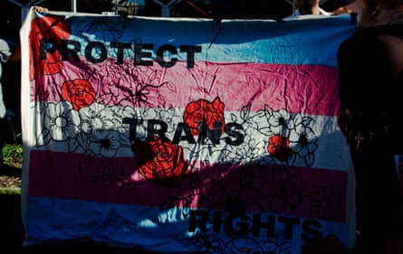 the sun shines through a large flag