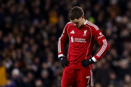 Florian Wirtz looks astatine his feet successful frustration
