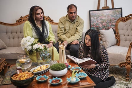 Masiha reading to her parents at home