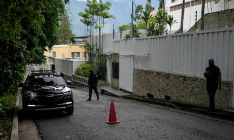 A police patrol car parked outside Argentina's embassy in Caracas