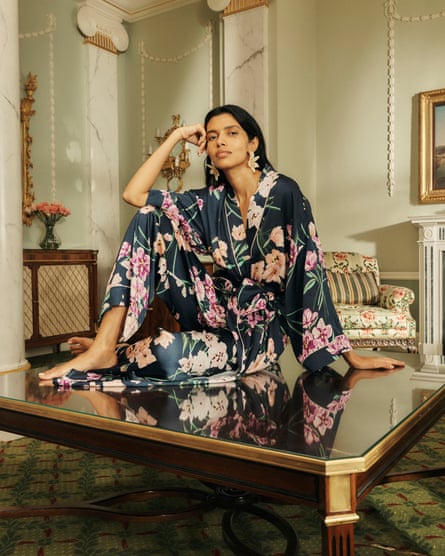 A model posing in floral pyjamas