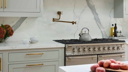 Kitchen showing stove with pot filler tap