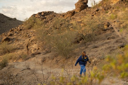 a woman walks along a trail