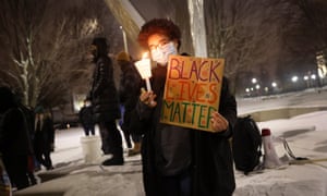 Activists show support for Jacob Blake Jr. during a vigil near the Kenosha County Courthouse on January 04, 2021 in Kenosha, Wisconsin. Jacob Blake Jr., 29, was shot seven times in the back by a Kenosha police officer on August 23 last year and and was left paralyzed from his injuries.