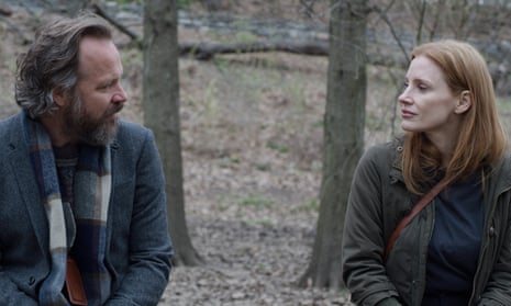 Peter Sarsgaard and Jessica Chastain in Memory, looking at each other in a forest.