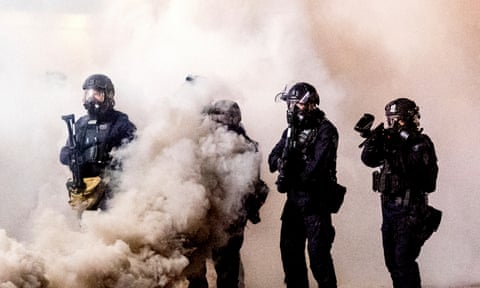 Federal officers use chemical irritants and projectiles to disperse Black Lives Matter protesters on 24 July 2020, in Portland.