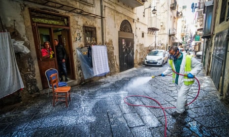 A worker disinfects the streets in Naples, Italy.