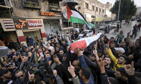 Palestinians carry the body of Jana Zakaran, 16, during her funeral in the West Bank city of Jenin, Monday, Dec. 12, 2022. Palestinian health officials said Zakaran was killed by Israeli fire during a military operation in the occupied West Bank. Palestinian media said her family found her body on the roof of their home after Israeli forces withdrew from the area. The Israeli military said it was investigating her death. (AP Photo/Majdi Mohammed)