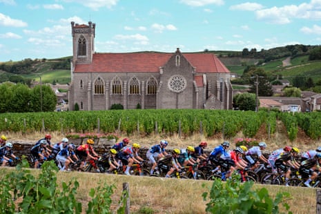The peloton rides on stage five.