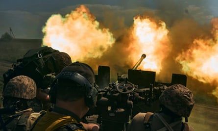 Ukrainian soldiers fire a cannon near Bakhmut, an eastern city where fierce battles against Russian forces have been taking place, in the Donetsk region, Ukraine, 15 May 2023.