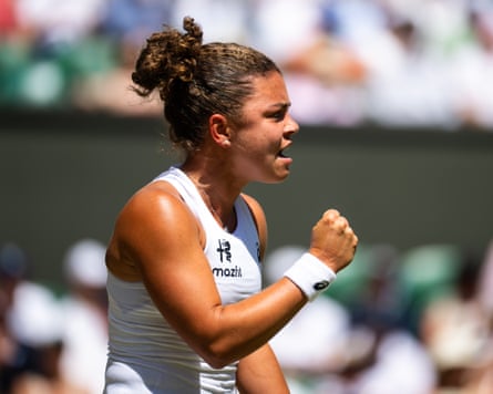 The tennis player Jasmine Paolini pumps her first to celebrate a point during her Wimbledon fourth round win against Alexandra Eala.