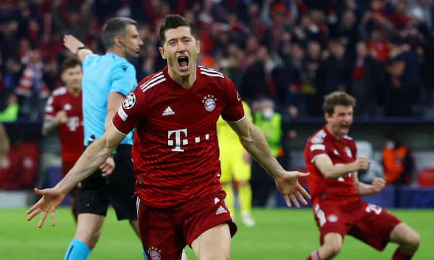 Bayern Munich striker Robert Lewandowski celebrates as Thomas Muller in the background.