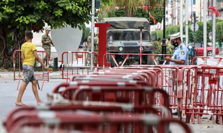 The Tunisian army monitors activity on Habib Bourguiba, one of the main streets of the capital Tunis