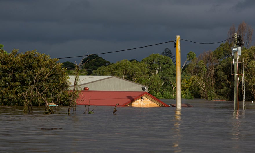Submerged buildings rise from flood waters at Pitt Town Bottoms, on Sydney’s outskirts.