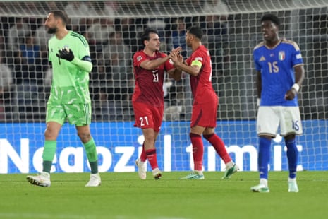 Turkey's Aral Simsir, centre left, celebrates with Zeki Celik after scoring his side's first goal.