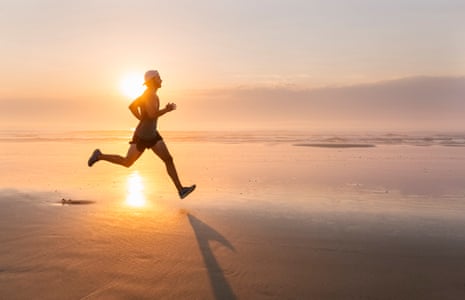 Man running on the beach at sunsetAvilés, Asturias, Spain