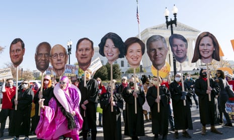 Abortion rights advocates holding cardboard cutouts of the supreme court justices demonstrate Wednesday in Washington DC.