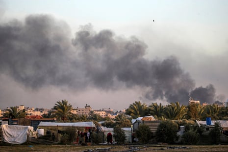 Smoke rises during Israeli military operations in Al Maghazi, Al Bureije and Al Nusairat refugee camps, as seen from southern Gaza Strip