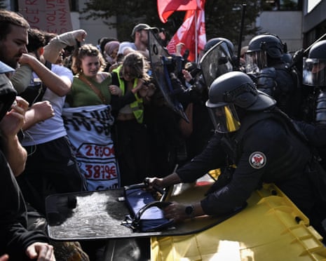 Clashes occur between riot police and demonstrators during a high school students' protest against education conditions in Saint-Denis, north of Paris, France.