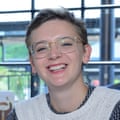 Smiling face of a young woman wearing glasses