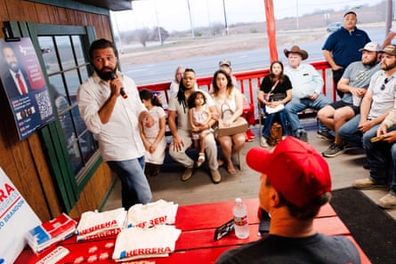 a man speaks to supporters