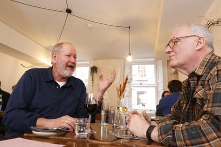 Geoff and Terry chatting at a restaurant table