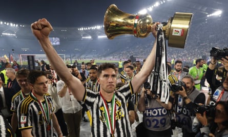 Dusan Vlahovi holds the trophy aloft after the Coppa Italia final