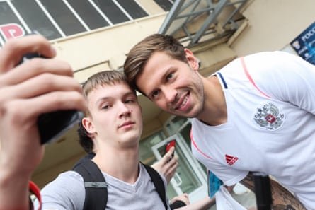 Fyodor Smolov meets a fan after training in Moscow.