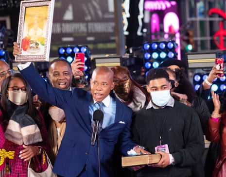 Eric Adams is sworn in after New York’s New Year’s Eve celebrations in Times Square. Many progressives are approaching Adams’ mayoralty with caution.