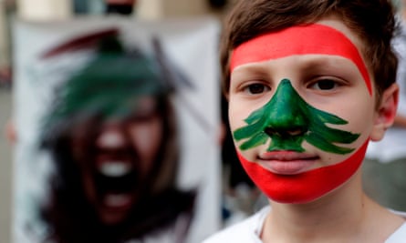 A boy takes part in anti-government demonstrations in Beirut on Saturday.