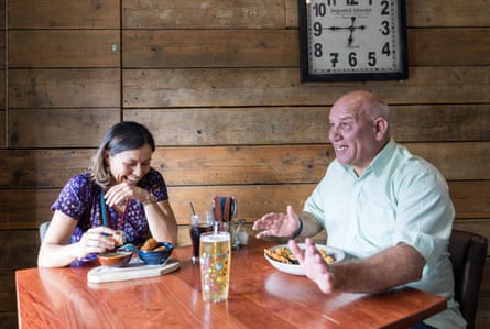 Sunyi and Francis chatting at a restaurant table
