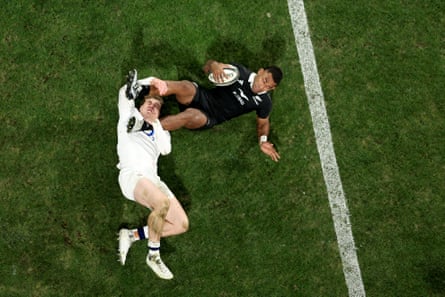 Sevu Reece rides the tackle of Tommy Freeman to score.