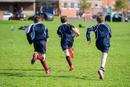 Teenage boys playing rugby at a secondary school in Wales. The impact of our schooling lasts far beyond exam results.