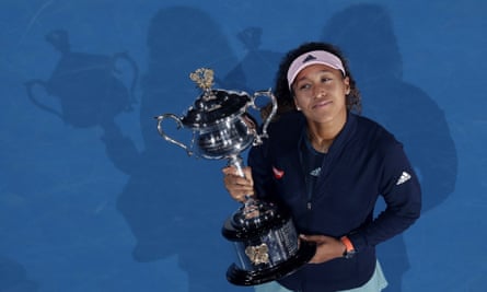 Naomi Osaka holds the Australian Open women’s singles trophy after dramatically defeating Petra Kvitova in last year’s final.