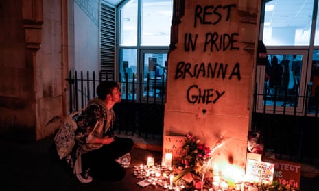 Candles burn at a makeshift memorial in London