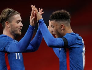 Jadon Sancho (right) celebrates scoring with Jack Grealish.