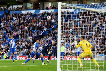 Chelsea's Cole Palmer scores their first goal past Brighton & Hove Albion's keeper Bart Verbruggen.
