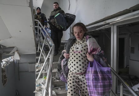 Mariana Vishegirskaya, an injured pregnant woman, walks downstairs in a maternity hospital damaged by shelling in Mariupol, Ukraine on 9 March